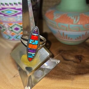 Sterling silver ring with gemstones and shell inlay.